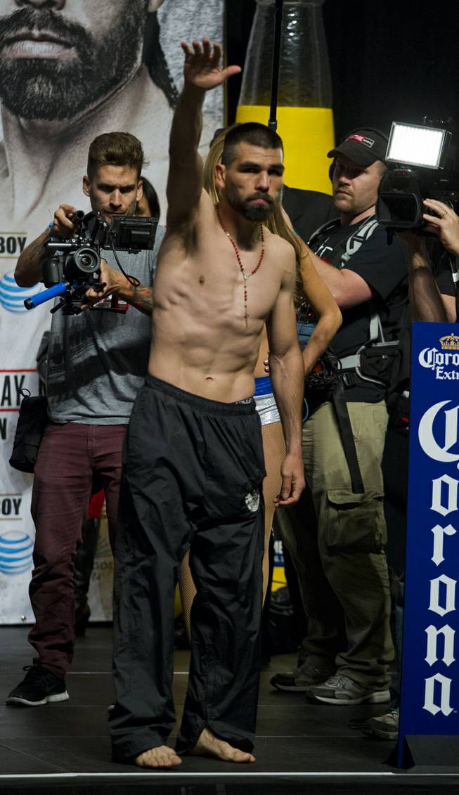 Super welterweight Alfredo "El Perro" Angulo of Mexico waves to the crowd following his weigh-in at the MGM Grand Arena on Friday, March 07, 2014.